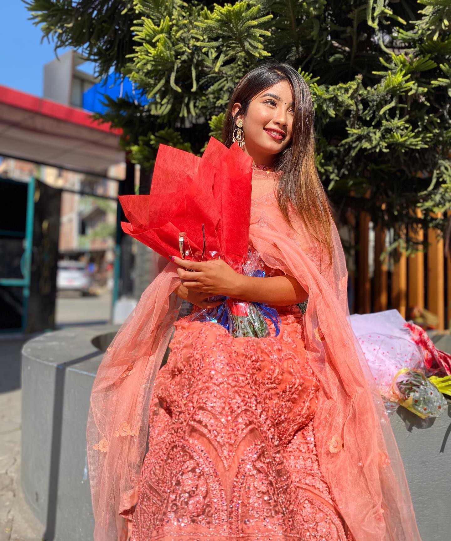 Sandhya in traditional attire, blending cultural elements with modern glamour